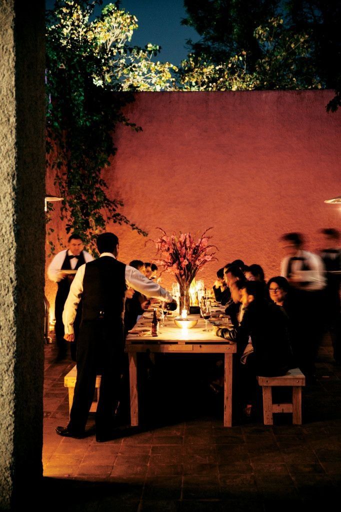 An intimate candlelit group dinner on the estate
